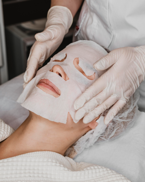 woman-getting-skin-mask-treatment